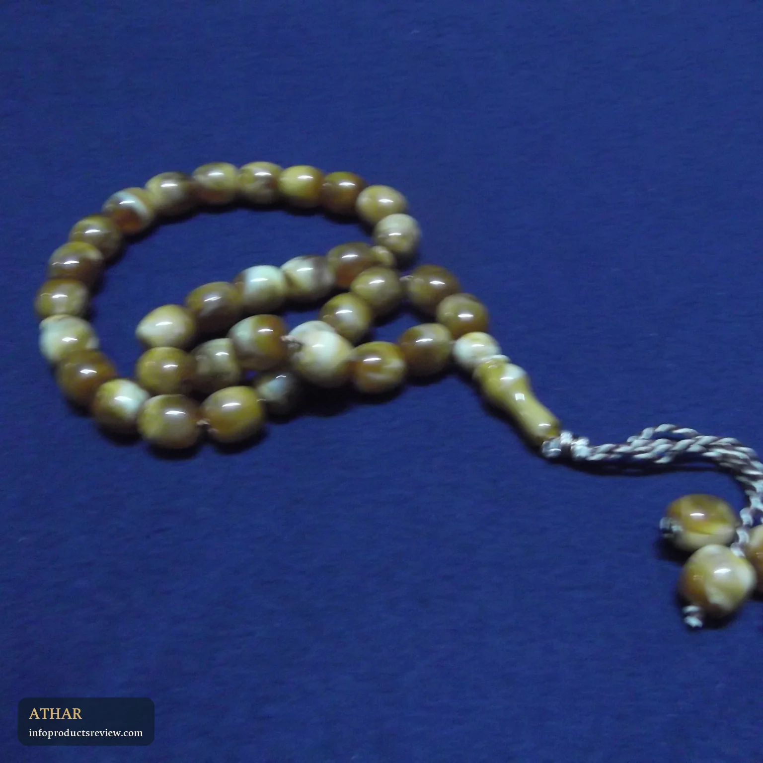 Prayer beads on blue cloth standing for prayers for the dead and a sense of calm