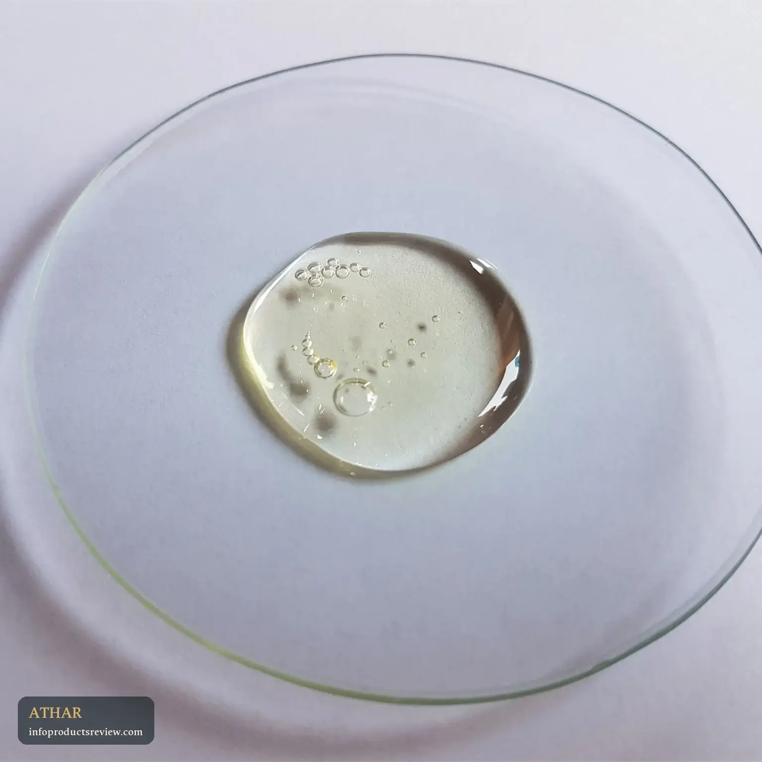 A clear, still drop on a glass dish