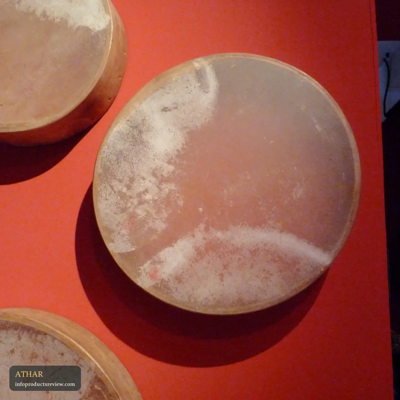 Traditional frame drums on display in a museum